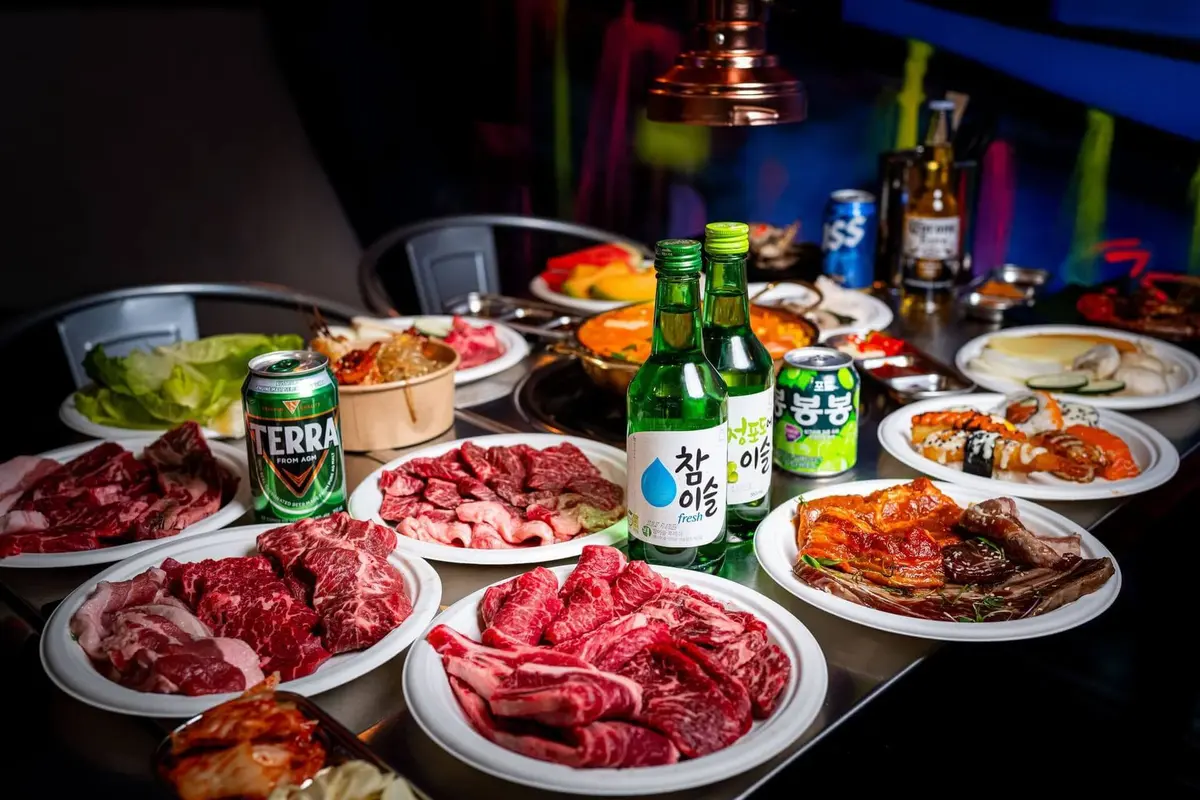 Korean BBQ sizzling on a charcoal grill at Paroro in Melbourne CBD